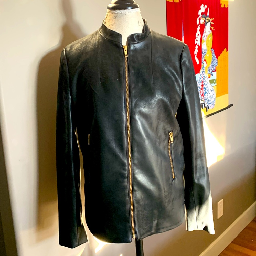 Charcoal colored leather jacket. Zippers on sleeves pockets and sides. No damage